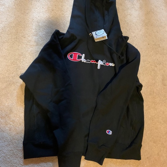 black champion hoodie with red logo